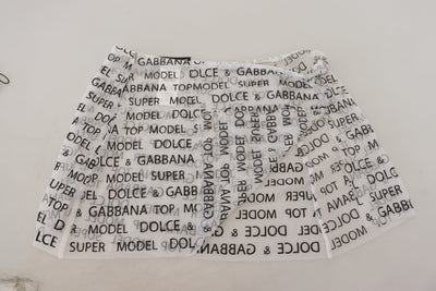 Mini-jupe trapèze transparente à logo blanc Dolce &amp; Gabbana