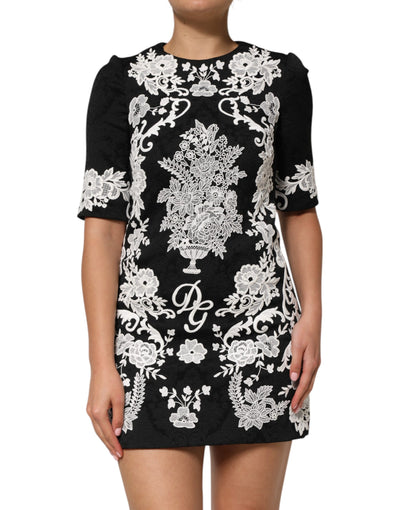 Dolce &amp; Gabbana zwarte A-lijn jurk met kanten rand en korte mouwen