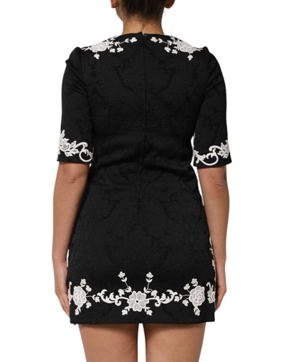 Dolce &amp; Gabbana zwarte A-lijn jurk met kanten rand en korte mouwen