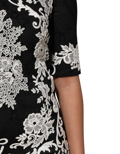 Dolce &amp; Gabbana zwarte A-lijn jurk met kanten rand en korte mouwen