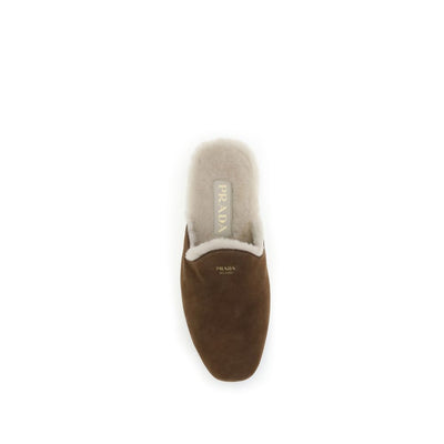 Mules en daim Prada